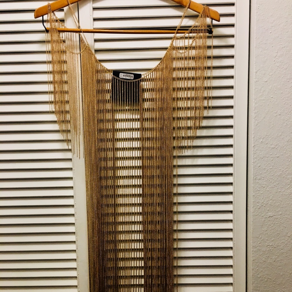 Bebe gold chain top.Great extravagant accessory.